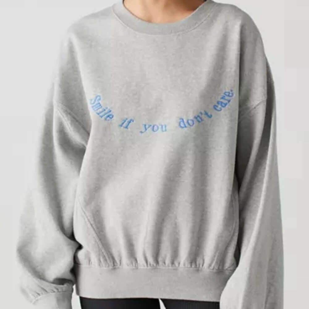 Urban Outfitters embroidered "smile if you don’t care" crewneck sweatshirt